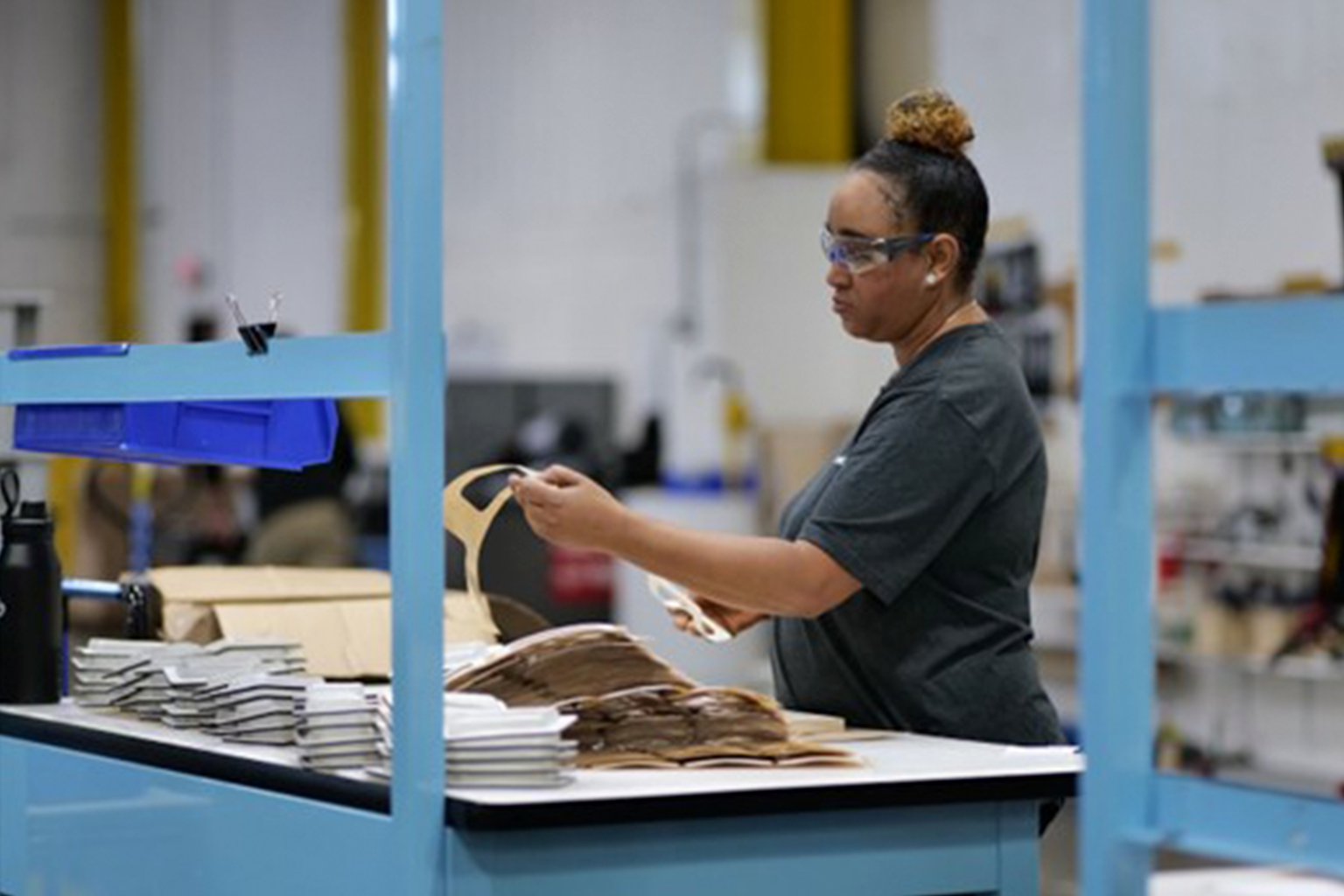 Cohesive Components employee testing a product